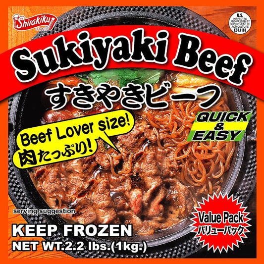 Shirakiku 브랜드의 스끼야끼용 소고기 패키지, 짙은 붉은색과 검정색 디자인의 포장에 'Sukiyaki Beef'라는 글자와 일본어로 'おおきなビーフ'가 적혀 있으며, 'Beef Lover size'와 'Quick & Easy'라는 슬로건이 눈에 띄게 표시됨. 제품은 미국 농무부 검사를 받았으며 1kg의 무게가 표기된 냉동 포장으로, 요리 제안 이미지에는 맛있게 조리된 스끼야끼가 보임
