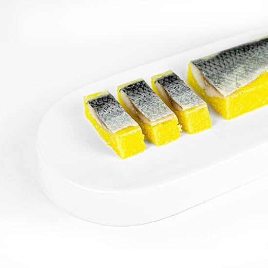 Slices of Kazunoko Nishin herring roe fillets arranged on a white plate