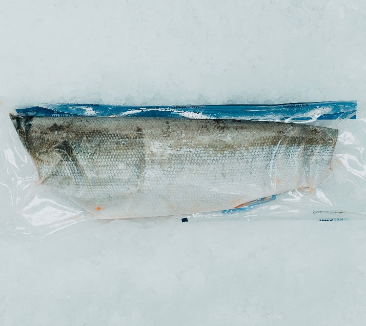 "Vacuum-sealed Sockeye salmon fillet on ice, showcasing its fresh, vibrant color and packaging details