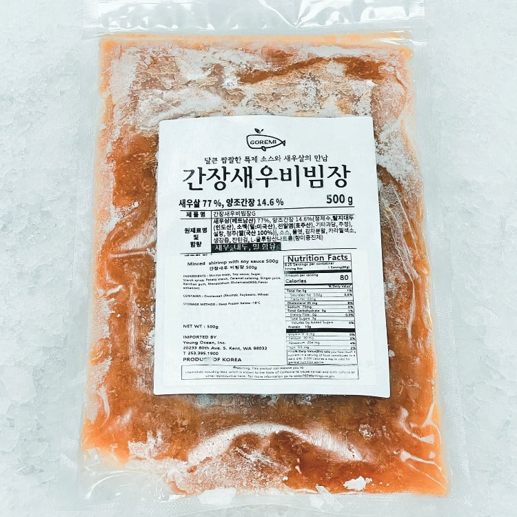 Vacuum-sealed package of Goremi seasoned shrimp with soy sauce, labeled in Korean and English. The package includes nutrition facts and product details, with the contents weighing 500g