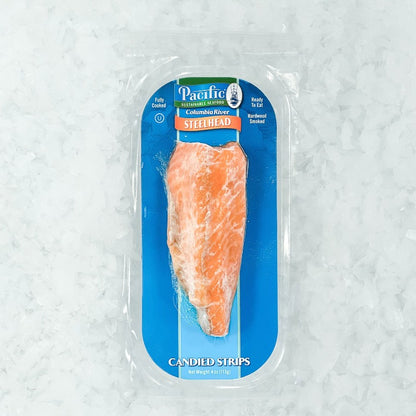 Front view of Pacific Sustainable Seafood Steelhead Candied Strip packaging, displayed on ice, 4 oz (113 g) pack