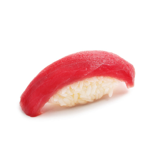 Sushi nigiri with a slice of fresh Yellowfin Tuna on a bed of vinegared rice, showcasing the vibrant red color and premium quality of the tuna.