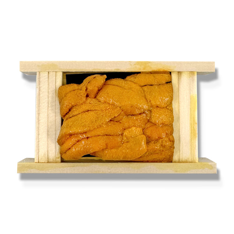 Premium uni sea urchin roe in a wooden box - fresh and high-quality sushi ingredient