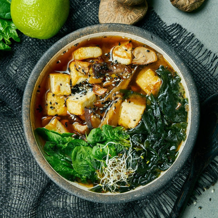 Tofu and spinach soup with a hint of lime, a nutritious and flavorful dish perfect for a light and refreshing meal